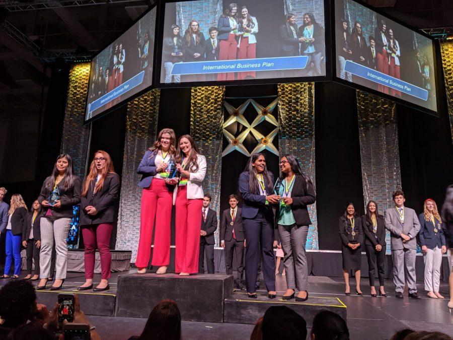 Sophomore Independence DECA members Shresta Dantuluri and Shreya Chacko (far right) placed second in the International Business Plan category at the Virginia State Leadership Conference. “We didn’t expect to win at all,” Chacko said. “We got on stage and we were just in shock.” Photo courtesy of Indy DECA.